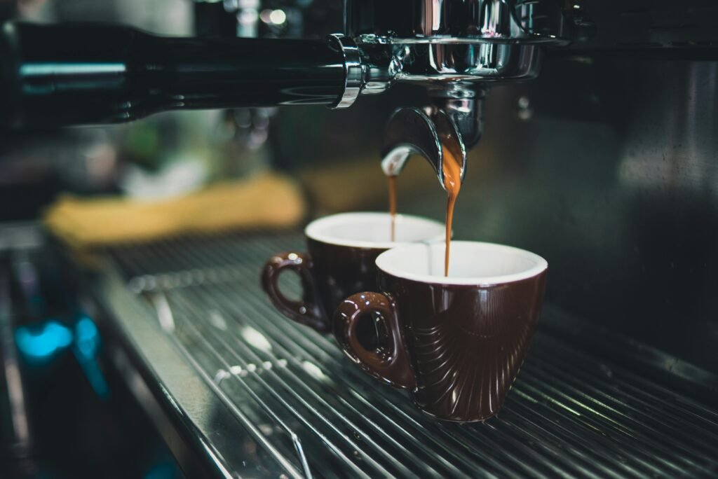 How to Fix Night Shift Sleep Problems: 7 Effective Solutions for Better Rest 4 Close-up of a professional espresso machine brewing coffee into cups.