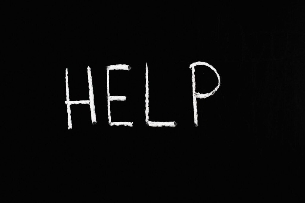 What to Do When Night Shift Insomnia Won't Go Away: Breaking the Cycle 9 Chalk-written 'HELP' on a deep black background symbolizes assistance and encouragement.