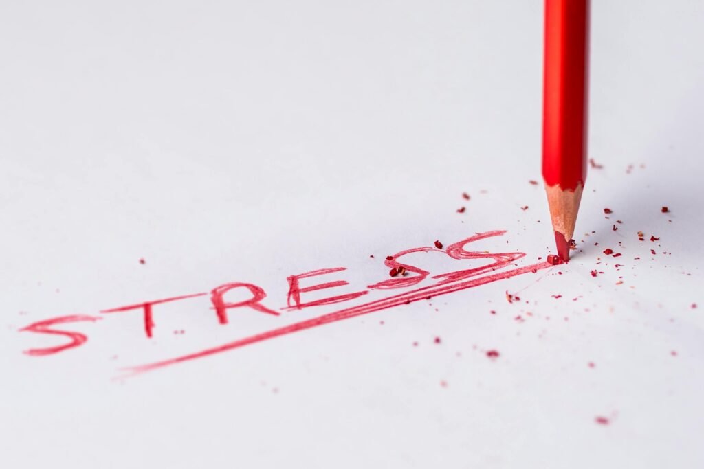 Stop Night Shift Weight Gain: 8 Proven Metabolism Boosters 8 Close-up of a red pencil writing 'stress' on paper, symbolizing pressure and creativity.