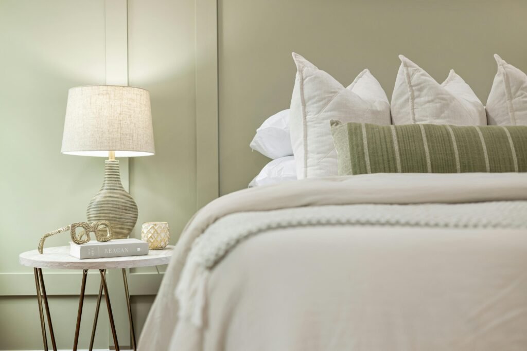 How to Build Immunity Against Frequent Night Shift Illnesses 3 Elegant bedroom scene featuring a modern lamp, plush pillows, and soft bedding for a serene ambiance.