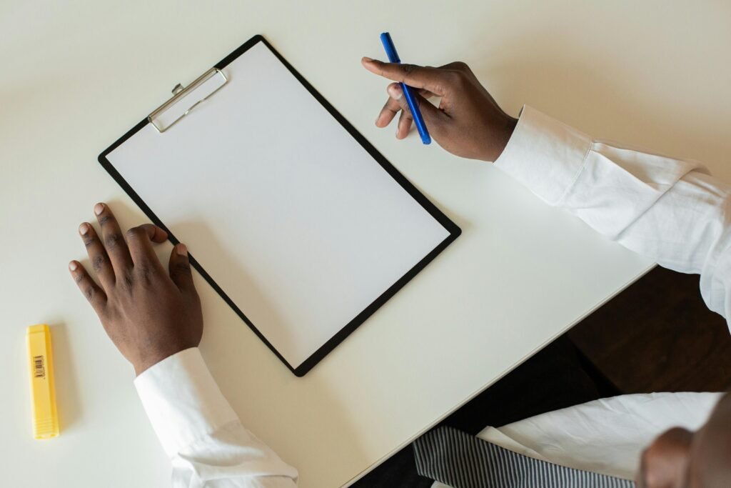 What to Do About Night Shift Memory Problems and Cognitive Decline 8 Overhead shot of a businessman with a clipboard and pen on a desk, ready to take notes.