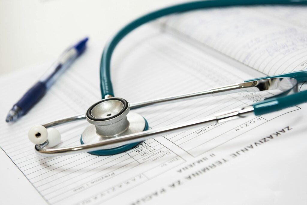12-Hour Night Shift Meal Plan: Strategies to Stay Energized and Eat Healthy 7 A stethoscope and pen resting on a medical report in a healthcare setting.