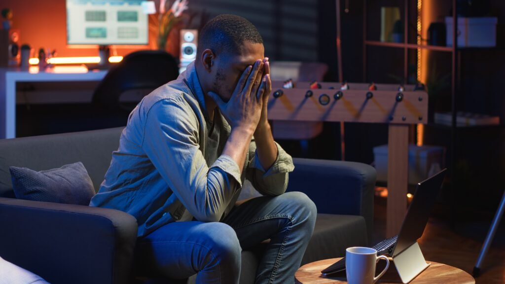 tired black man failing some tasks struggling focus home 1