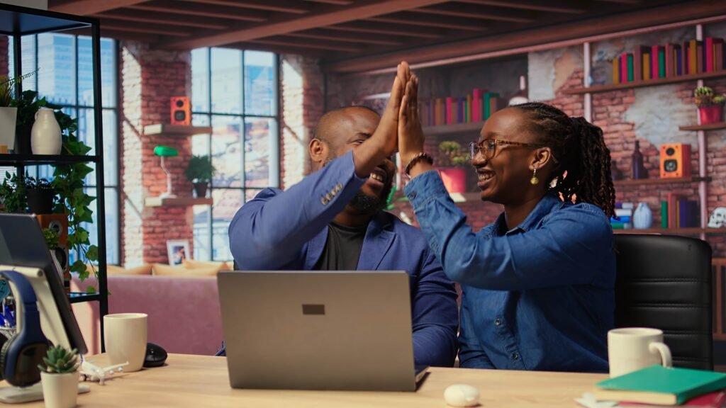 black freelancing couple doing high five celebrate their achievement 1