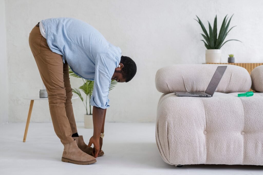 full shot man stretching home 1