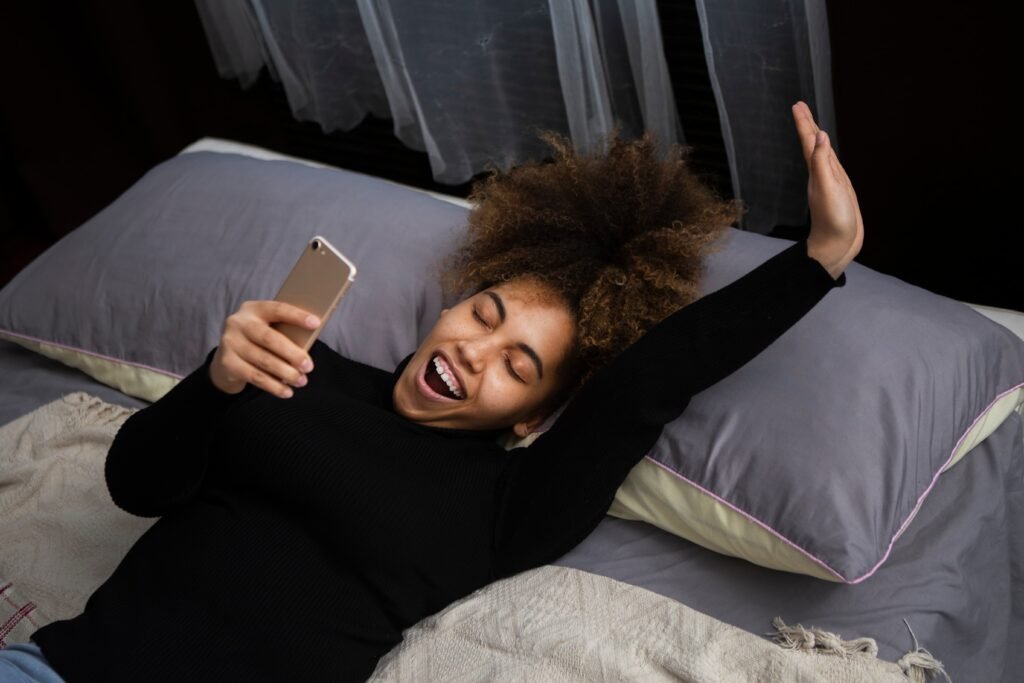 medium shot woman holding smartphone 1