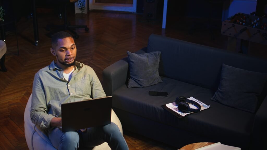 Remote night shift jobs showing person working from home on computer at night