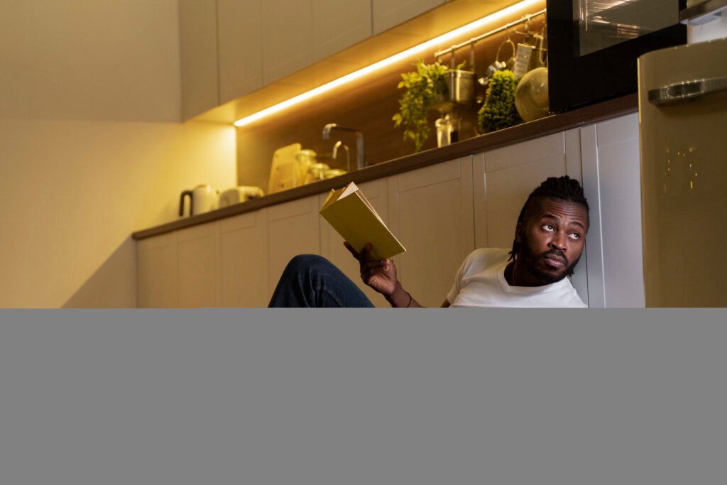 african american man eating reading