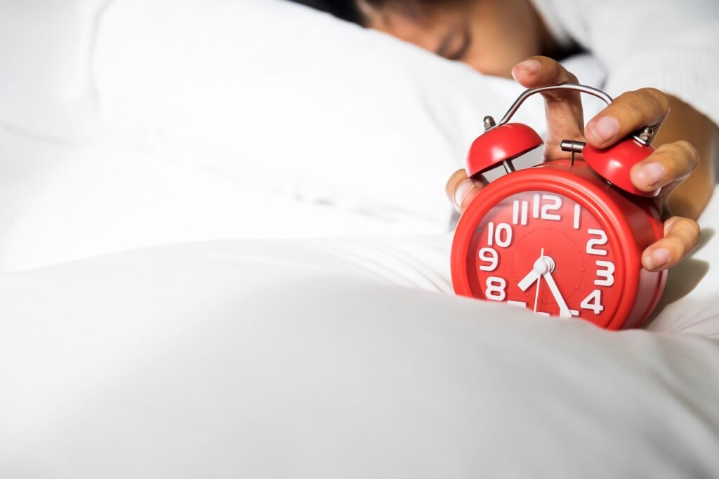 girl turns off alarm clock waking up morning from call 1