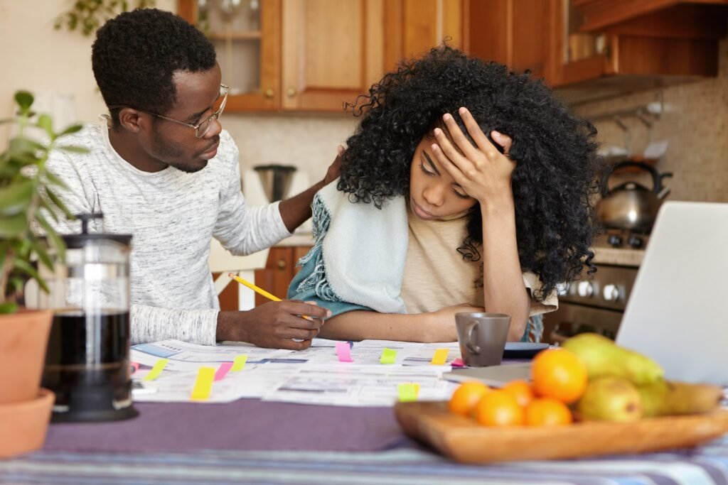 Night Shift Parenting: How to Stay Present When Your Schedule Works Against You 4 young dark skinned woman feeling stressed holding head despair 1