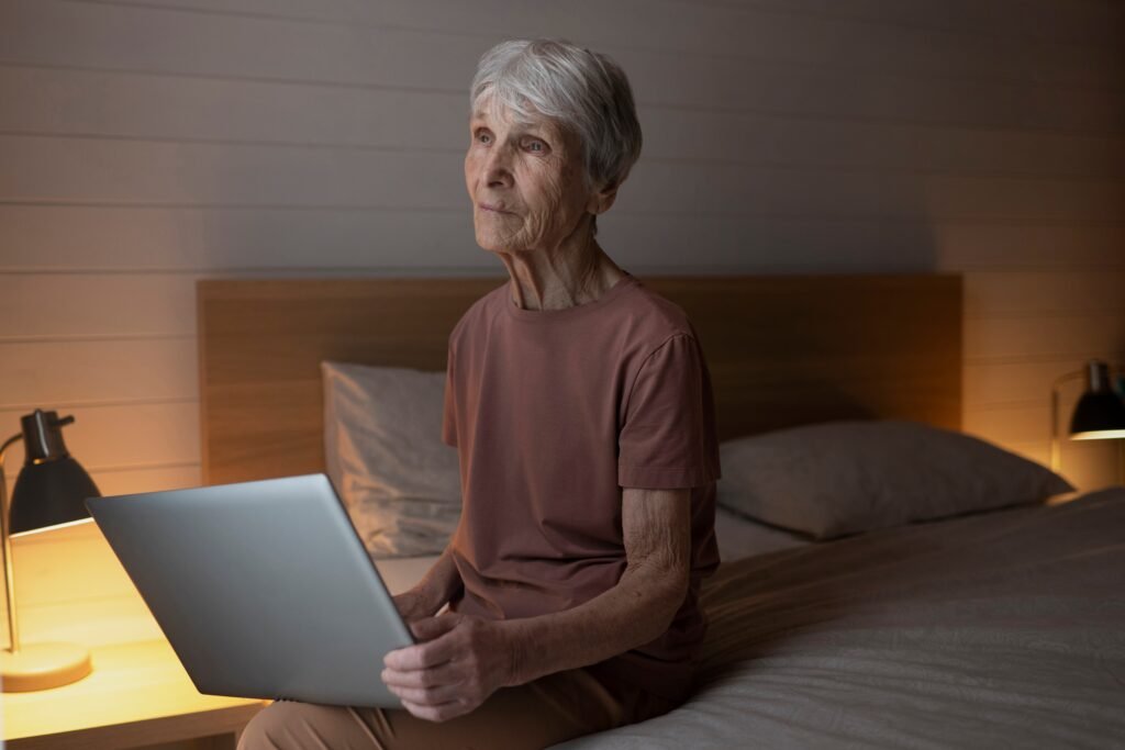 Does Night Shift Make You Age Faster? What the Science Actually Says 2 Night shift worker looking tired in mirror reflecting the effects of accelerated biological aging from overnight work