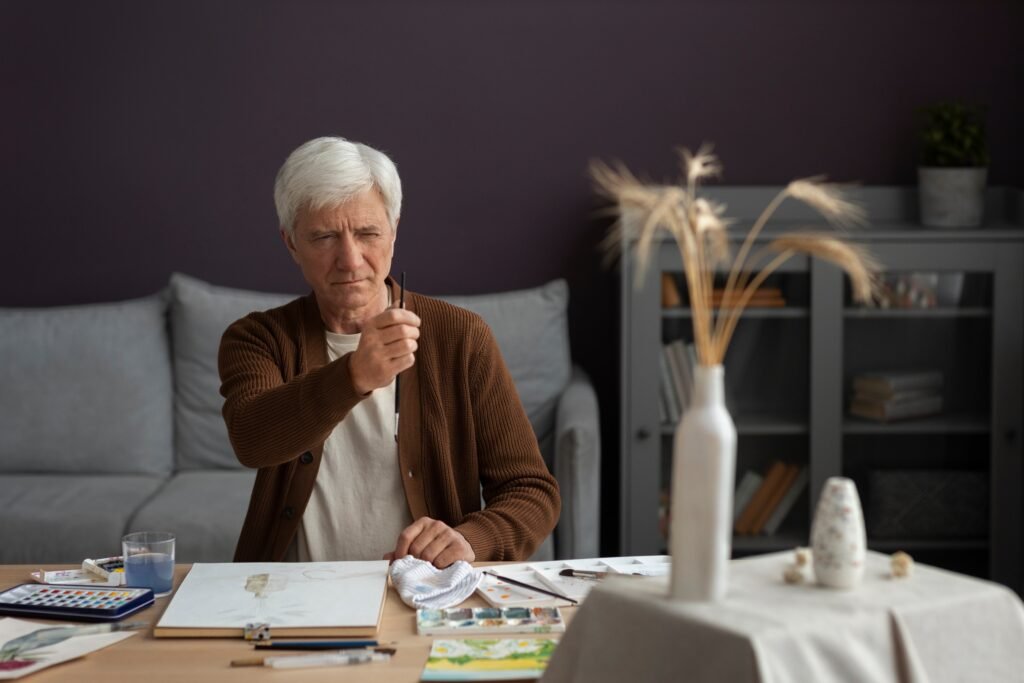 Night Shift Finances: How to Actually Get Ahead When Your Schedule Works Against Your Wallet 4 senior painter using watercolor his art 1