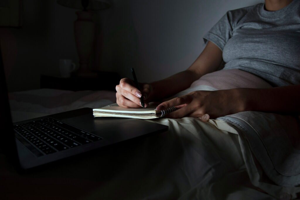woman bed working late 1