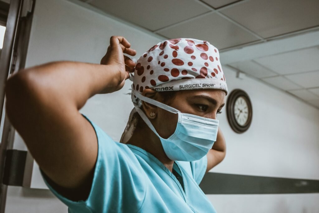 Night Shift Tips for New Nurses: What Nobody Tells You Before Your First Overnight 2 New nurse in scrubs preparing for night shift with coffee and notes at a hospital nurses station