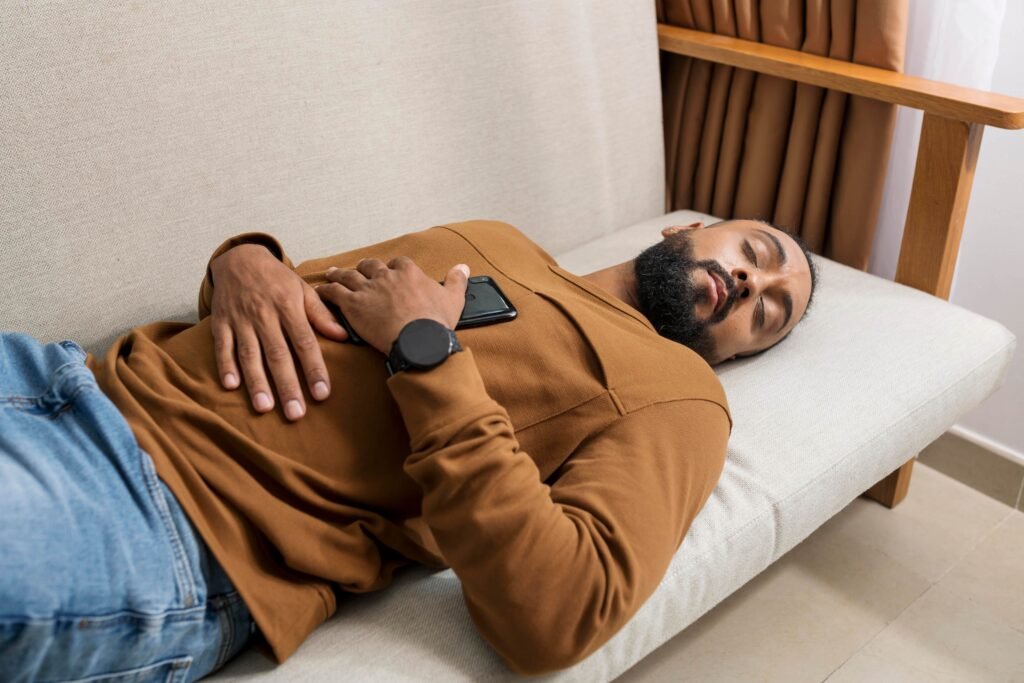 Night Shift and Back Pain: Why Your Spine Suffers on Overnights and How to Protect It 4 man being tired after spending too much time his phone 1