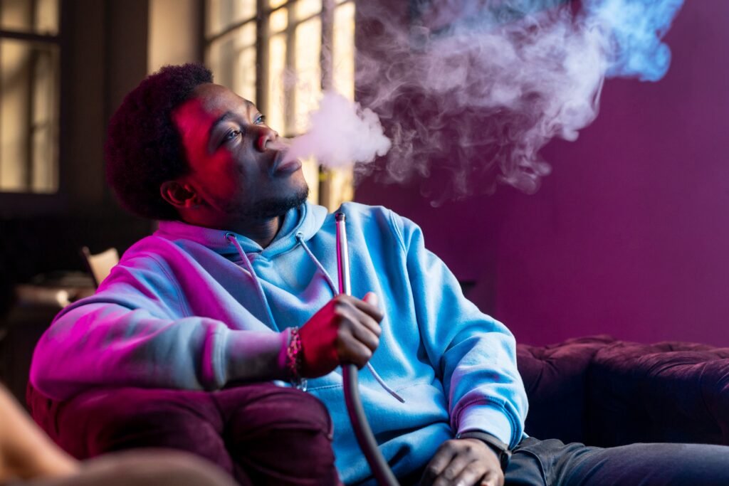Night Shift and Smoking: Why Overnight Workers Smoke More and Why Quitting Is Harder 2 man vaping from hookah indoors 1