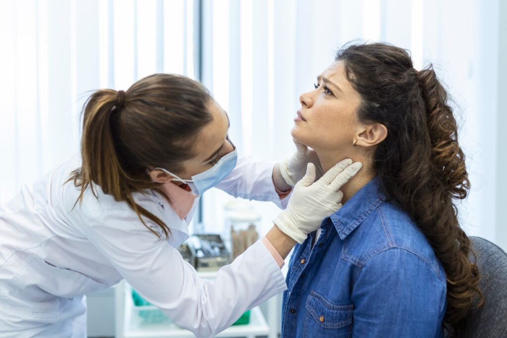 Night Shift and Thyroid Health: The Hidden Hormonal Disruption Nobody Warns You About 2 endocrinologist examining throat young woman clinic women with thyroid gland test endocrinology hormones treatment inflammation sore throat 1