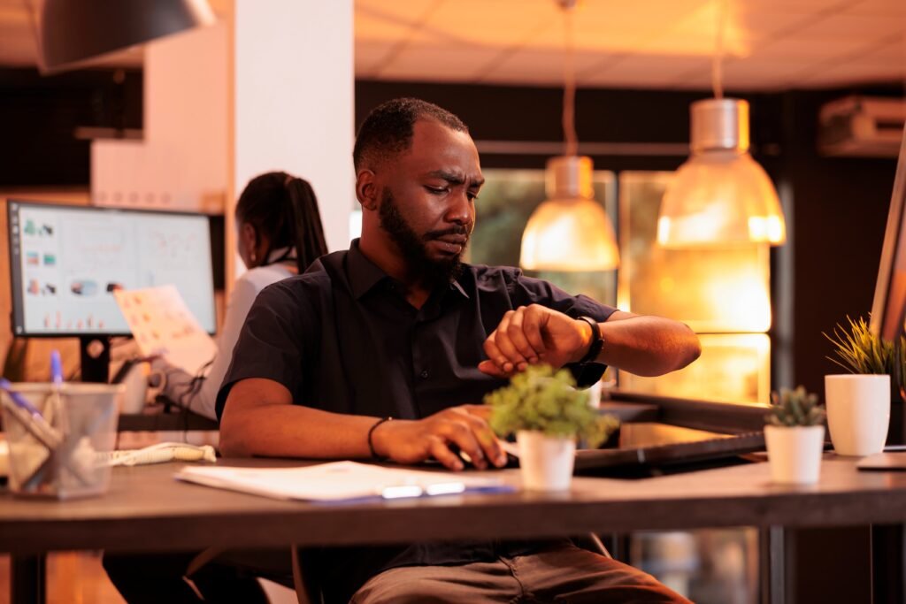 executive manager checking time wristwatch finish workday being punctual about business schedule task deadline looking clock see hour minutes busy sunset 1