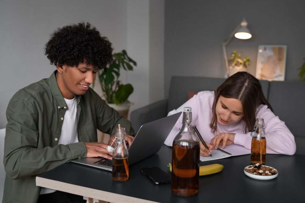 Caffeine vs Water on Night Shift: How to Stay Awake Without Crashing 2 people drinking kombucha gathering 1