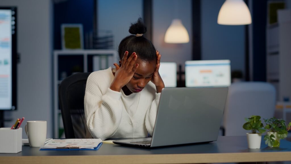 stressed businesswoman suffering from headache work doing overtime late night 1